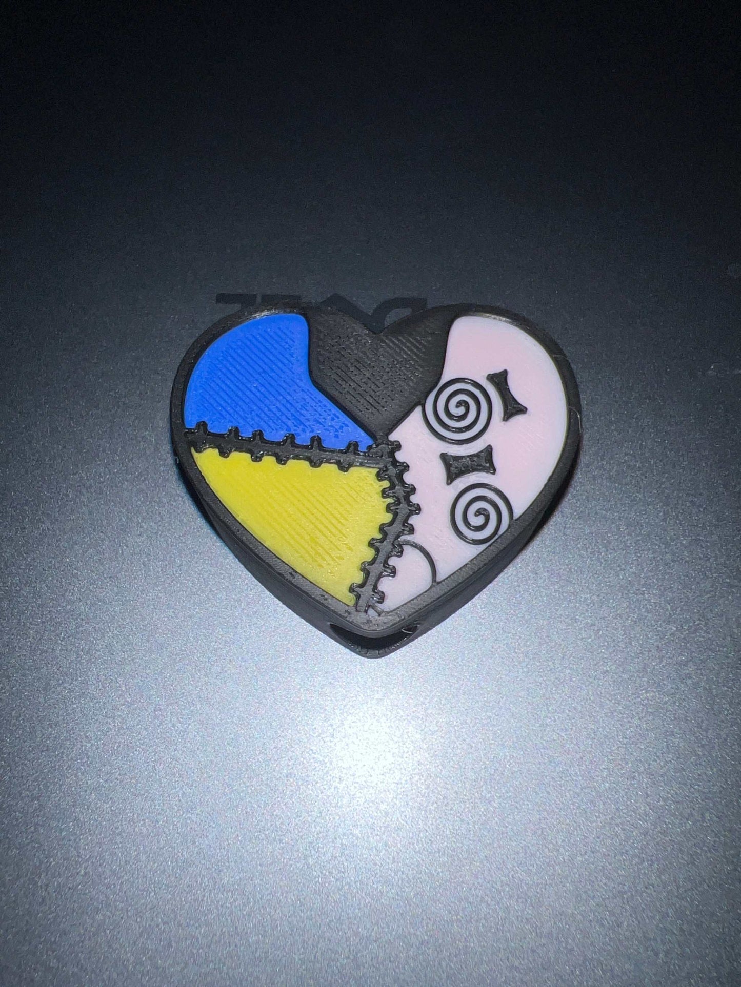 Sally Heart Straw topper with colorful patchwork heart design and spiral eyes