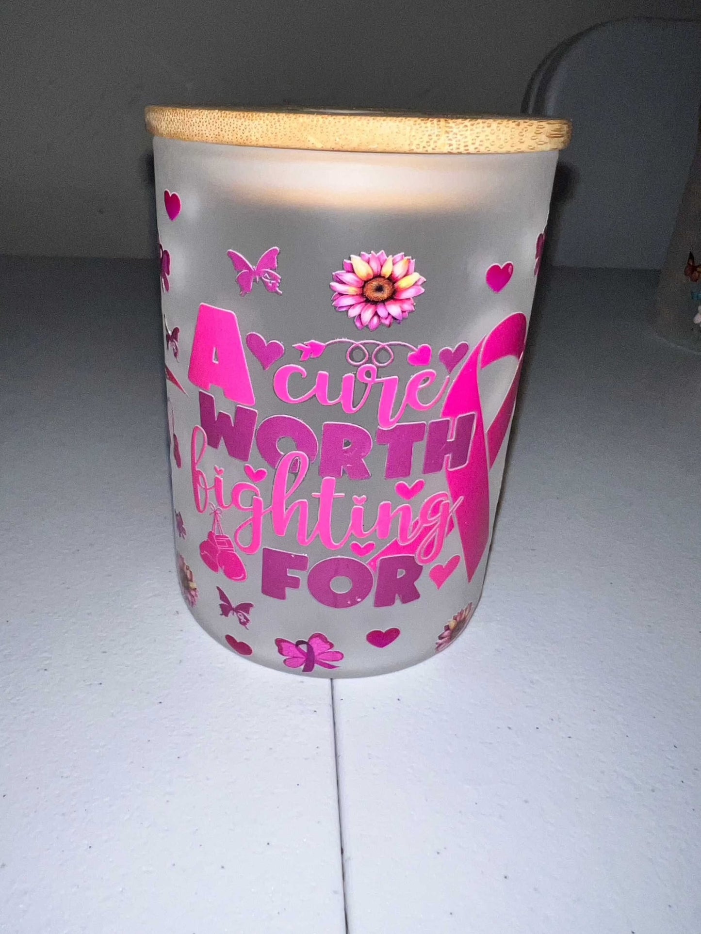 17oz Glass Mugs with bamboo lid on a white surface featuring pink decorative text and floral motifs.