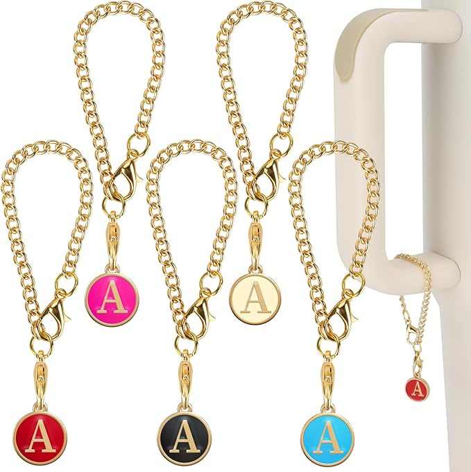Colorful letter charm keychains with gold loops and decorative initials.