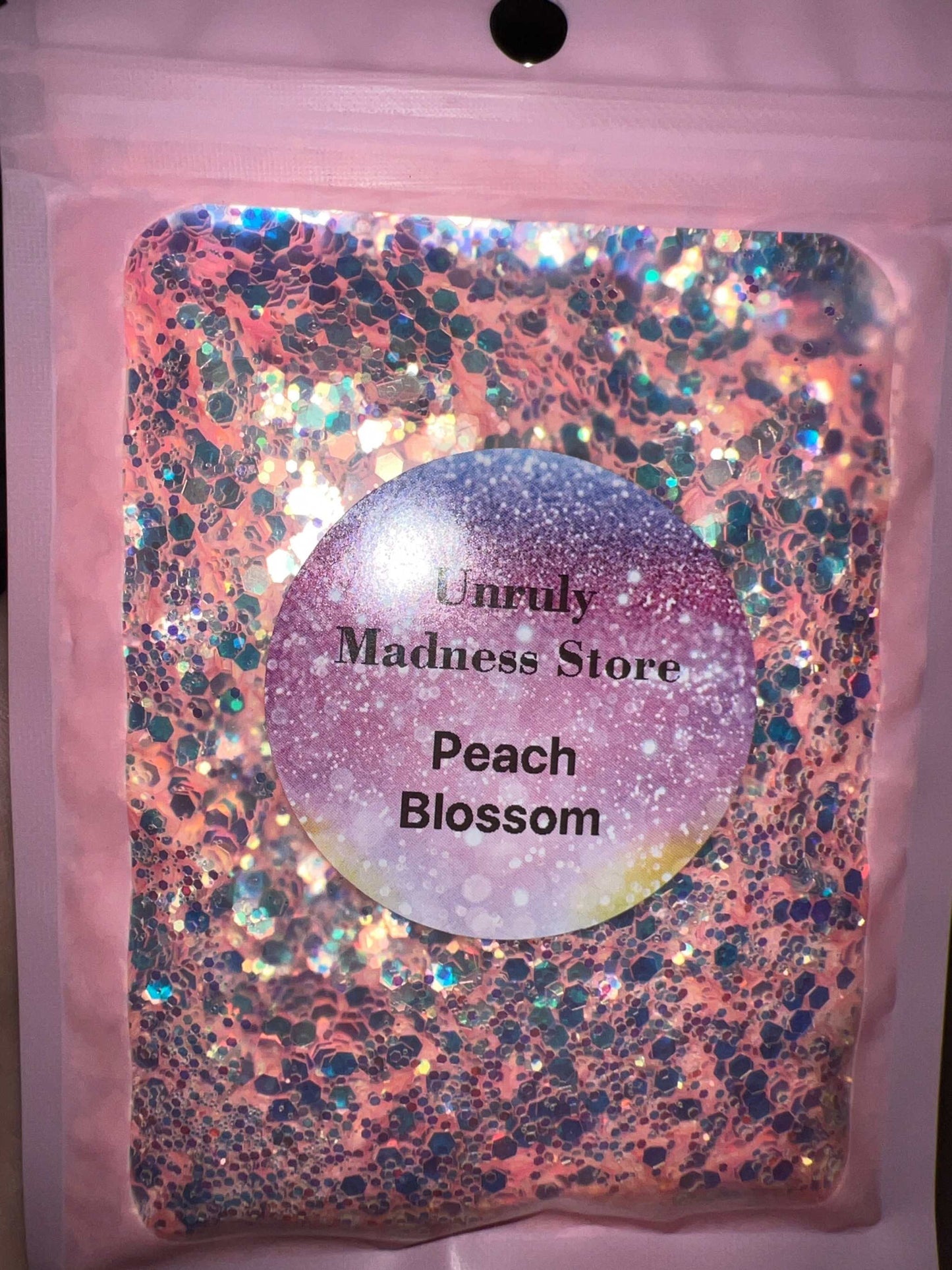 Peach Blossom 2oz polyester glitter in resealable pink bag with holographic accents