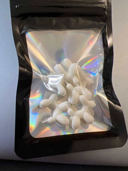 Pack of 5 white mini balloon dog lid toppers in a holographic black resealable bag