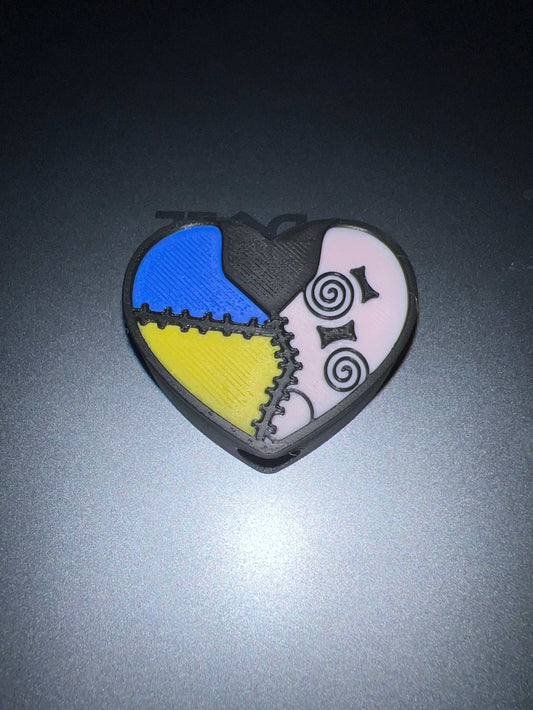 Sally Heart Straw topper with colorful patchwork heart design and spiral eyes