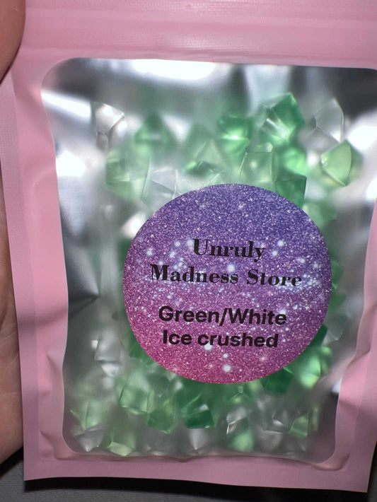 Green and white crushed ice glitter in pink resealable bag
