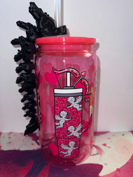 Pink cup with cupid design and black dragon straw topper attached to white straw