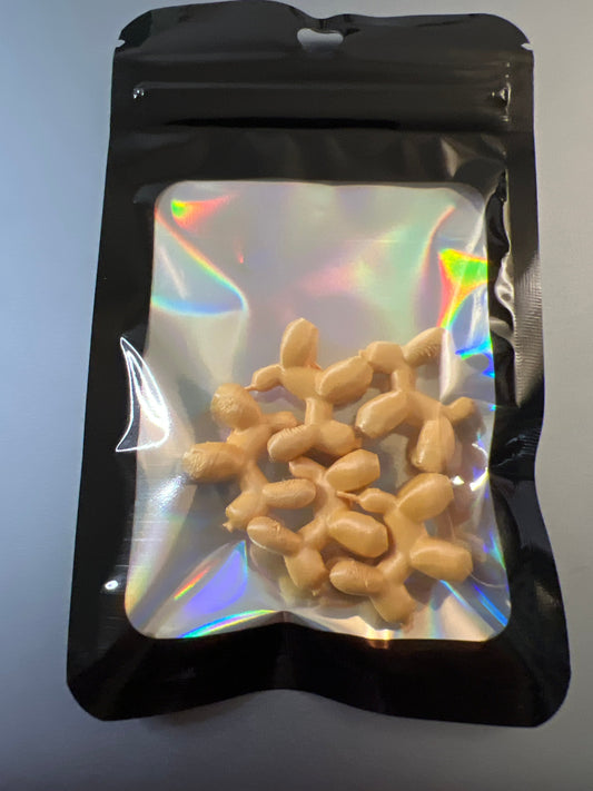Pack of five tan mini balloon dog lid toppers in resealable black holographic pouch