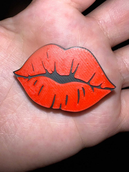 Red Lip straw topper shaped like lips held in hand