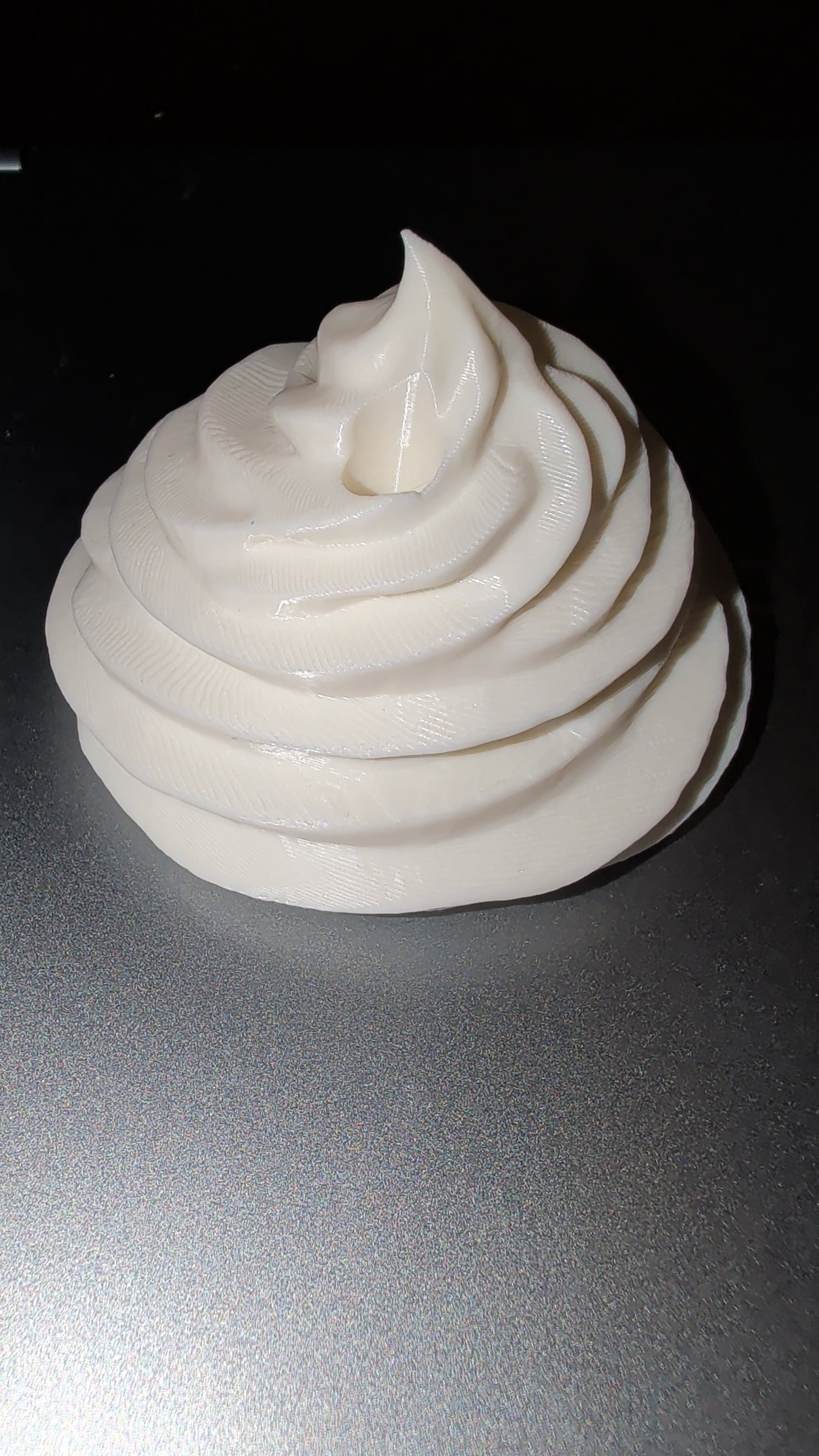 16-20oz whipped cream topper swirl on a dark surface
