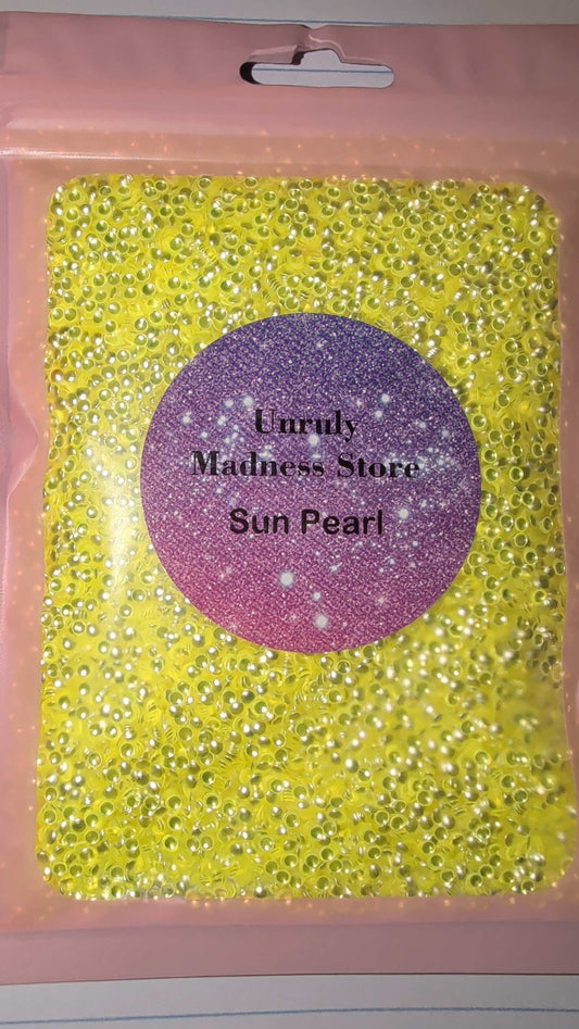 Sun Pearl 2oz polyester yellow glitter in pink packaging