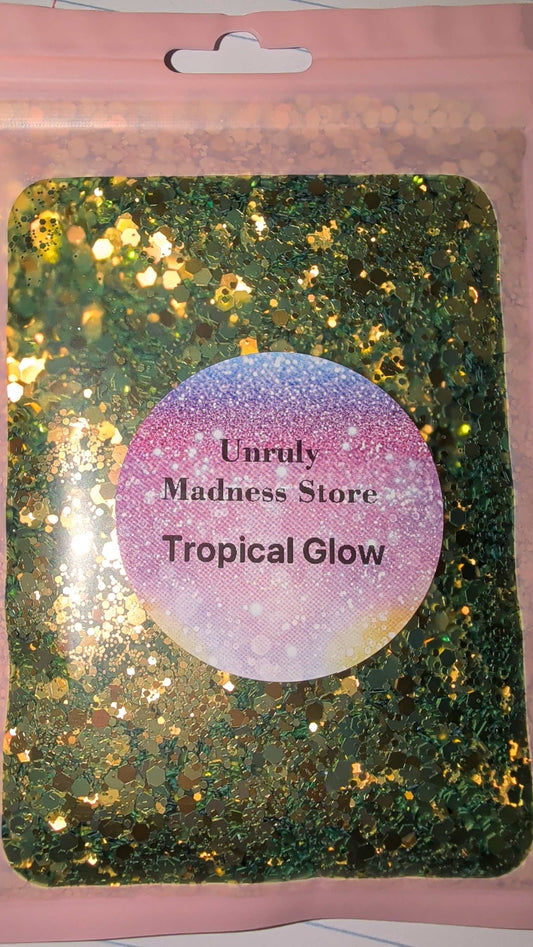 2oz Tropical Glow polyester glitter in green and gold hues in a pink resealable bag