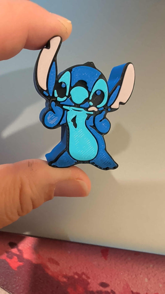 626 Straw topper featuring a blue cartoon character holding up two fingers