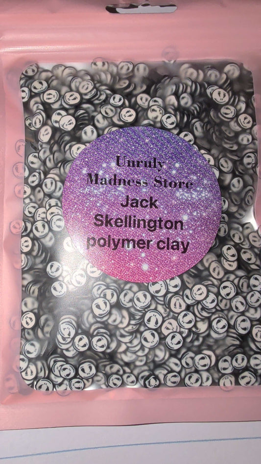 Jack Polymer Clay black and white smiley face slices with purple glitter label in pink packaging