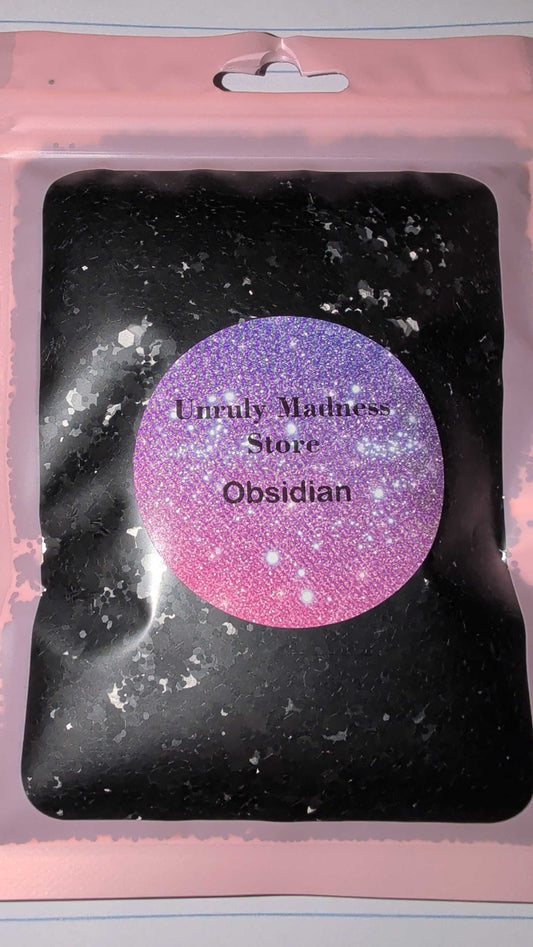 Obsidian 2oz polyester glitter in black resealable pink pouch with purple label