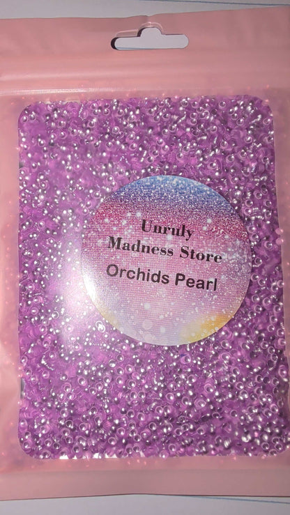 Orchids Pearl 2oz purple polyester glitter beads in resealable pink pouch