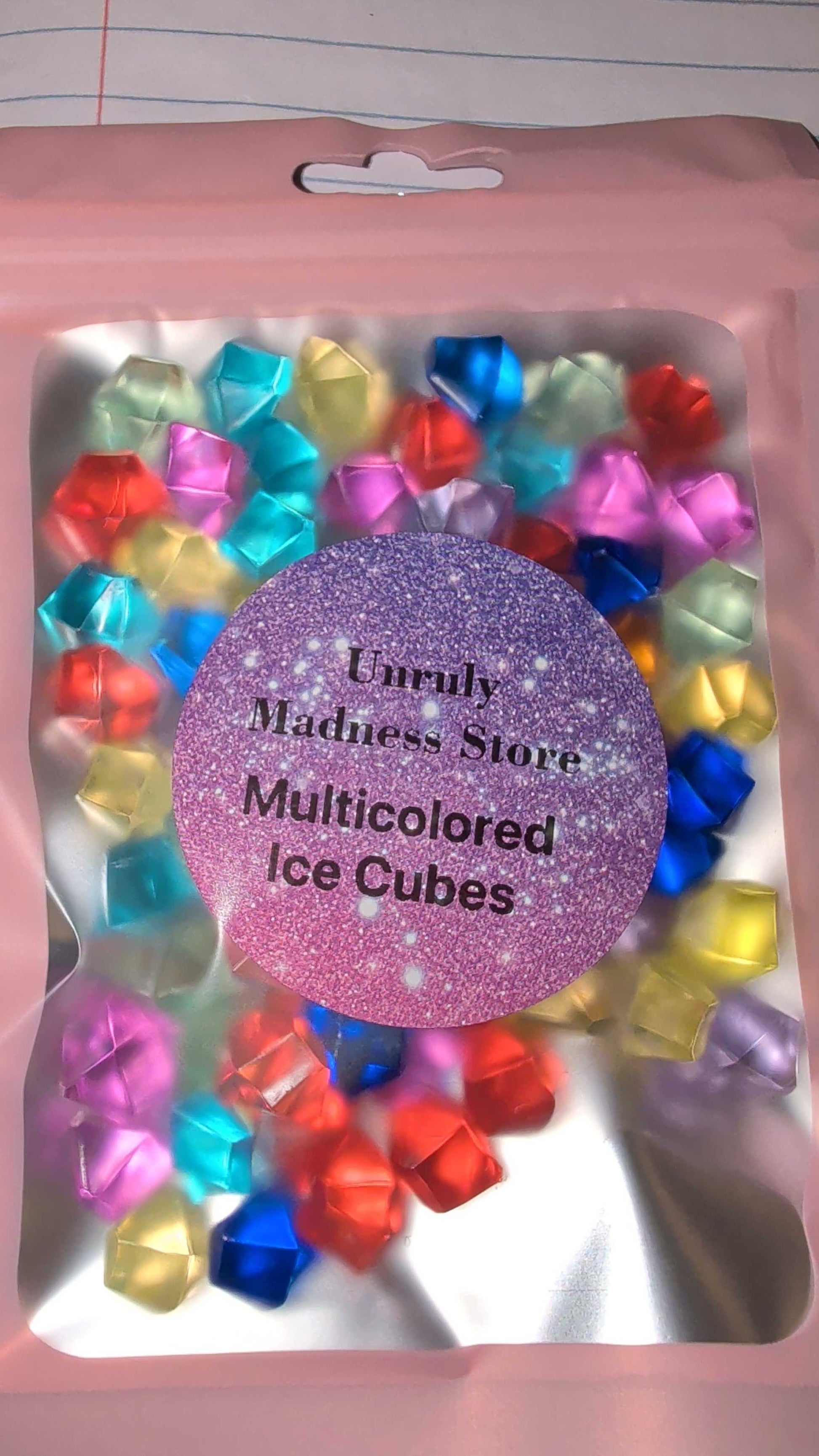 Package of multicolored ice cubes made of 2oz polyester glitter in various vibrant colors
