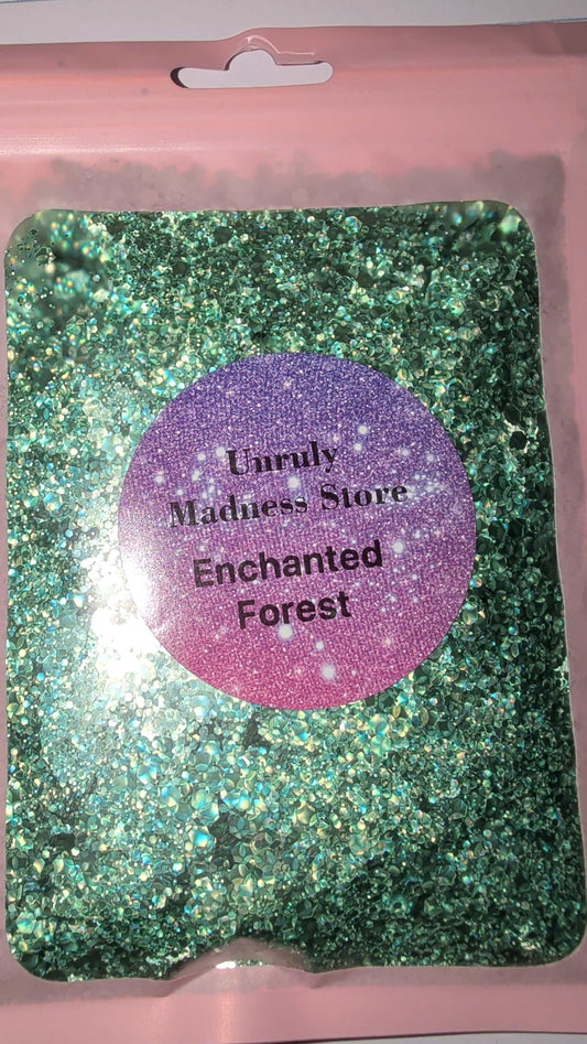 Enchanted Forest Glitter 2oz green polyester glitter in clear pouch with pink border and purple label